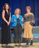 Jodi Woleslagle, center, Capital Blue Cross senior vice president of human resources, accepts Capital Blue Cross’ Best Places to Work in PA award on Dec. 8.